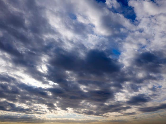 Dramatic clouds filling the sky at sunset